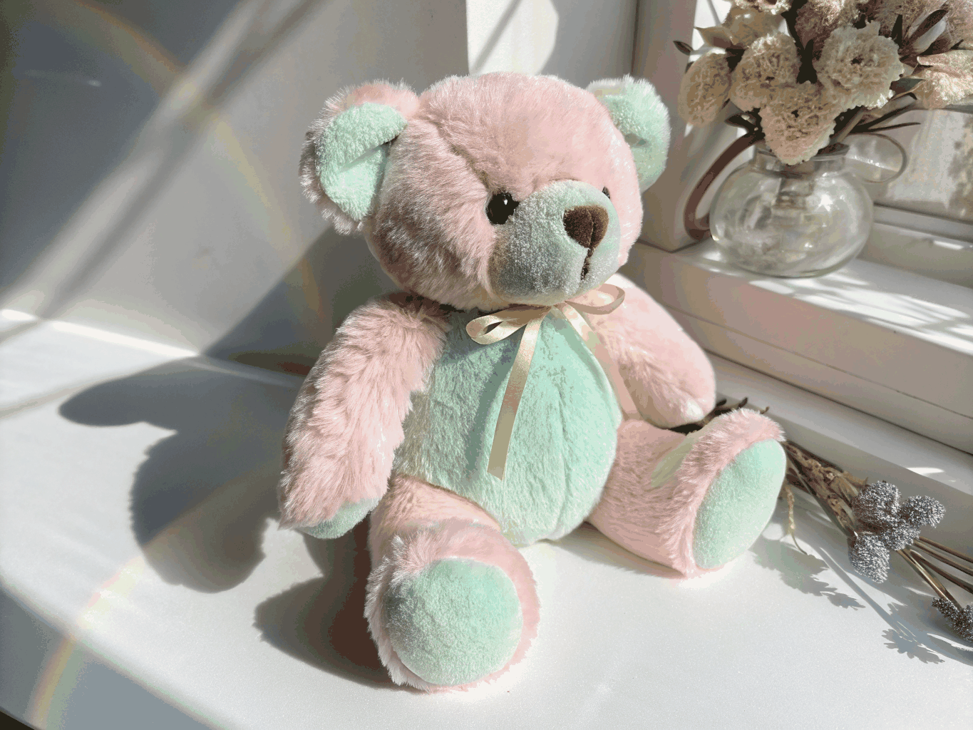 Classic golden-brown velvet plush teddy bear sitting in a sunny nursery